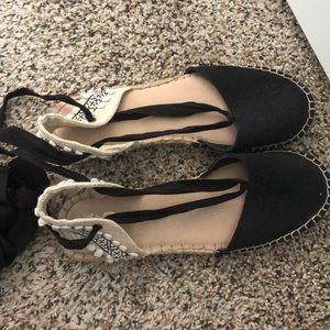 Black sandals with ankle tie straps